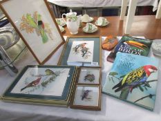 2 bird books, 5 bird pictures and a set of bird decorated table mats.