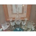 A cut glass decanter and selection of glasses. Collect Only.