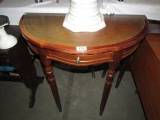 A D shaped hall table with leather inset top. COLLECT ONLY.