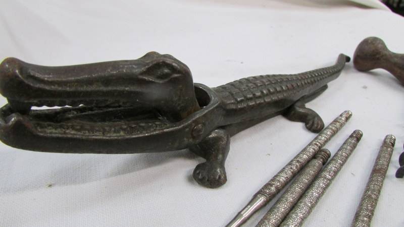 A vintage cast iron crocodile nut cracker, cork screws and bottle openers. - Image 3 of 3
