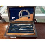 An Edwardian mahogany cased geometry set.