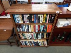 An oak veneer bookcase 83 cm x 33cm x 109cm.