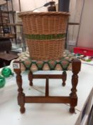 A vintage wicker waste paper bin and oak foot stool with woolwork top.