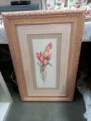 An ornate framed picture of tulips. 57cm x 87cm.