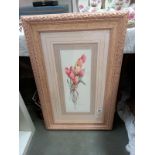 An ornate framed picture of tulips. 57cm x 87cm.