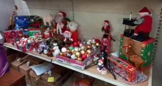 A good selection of Christmas tree decorations and lights and Santa figures.