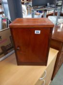 A small dark wood stained wall cupboard. 32cm x 26cm x 43cm.