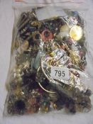 A bag of assorted costume jewellery.