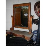 An early 20th century mahogany toilet mirror.