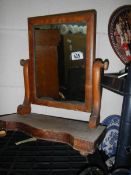 An early 20th century mahogany toilet mirror.