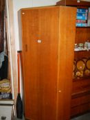 An old corner wardrobe/hall coat cabinet.