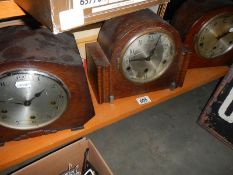 Three old mantel clocks.