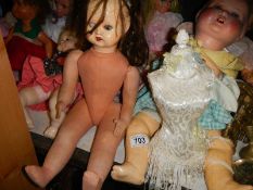 A quantity of vintage dolls.