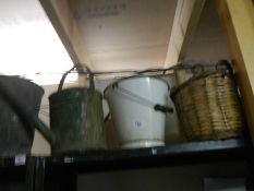 A vintage watering can, bucket etc.,