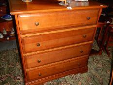 A four drawer mahogany chest of drawers.