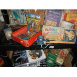 Two shelves of vintage games (unchecked for completeness).