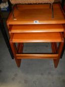 A good quality nest of three teak tables.