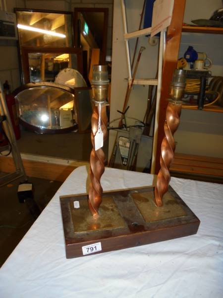Two deco style table lamps on wooden base.