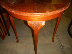 A D shaped hall table with glass top.