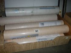 A quantity of new rolls of wall paper.