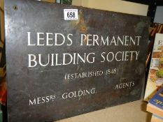 A solid brass Leeds Permanent sign.