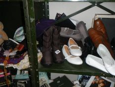 A quantity of boots, shoes and scarves.