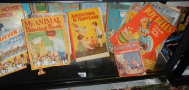 A mixed lot of books including children's.