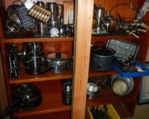 Three shelves of kitchen ware.