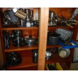 Three shelves of kitchen ware.