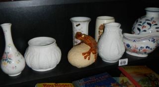 A shelf of assorted ceramics.