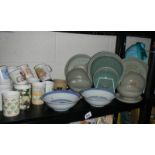 A mixed lot of ceramic plates, cups etc.,