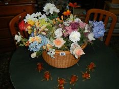 A mixed lot of artificial flowers.