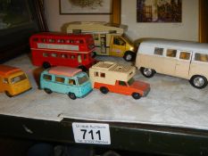 Five die cast camper vans and a bus.