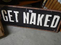 A metal 'Get Naked' sign.