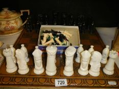 A chess set and other chess pieces.