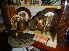 A mixed lot of brassware including jugs, candlesticks etc.,