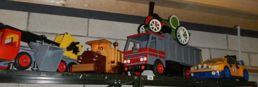 Four large toys including lorries.