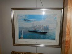 A framed and glazed print entitled 'Cunard Salute to the Queen' with Concorde flying above.