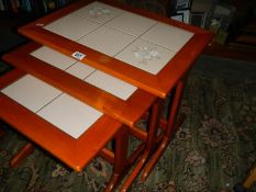 A good nest of three tiled top tables.