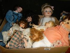 A box of collector's porcelain dolls.