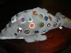 A collection of pin badges.