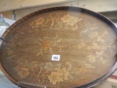 A Victorian oval inlaid tray with brass handles.