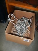 A quantity of plate stands and hangers.