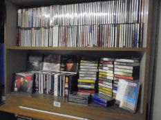 A large lot of CD's and cassette tapes.