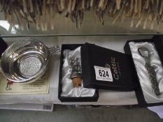 A Highland Quaich, Celtic bottle opener and bottle stopper, all boxed