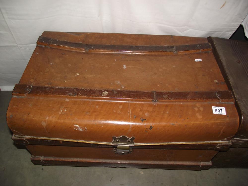A vintage tin travel steamer trunk