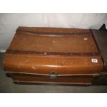 A vintage tin travel steamer trunk