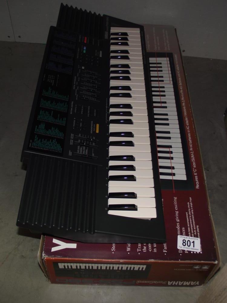 A boxed Yamaha Portasound keyboard (missing lead)