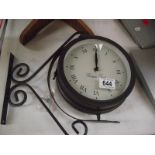 An outdoor double sided clock/barometer