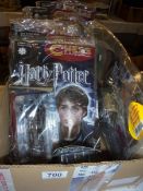 A quantity of Harry Potter chess pieces and magazines